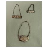Three sterling silver bottle tags