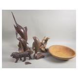 Group of carved wood figurines, bowl, and
