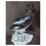 Signed and dated ceramic dolphin figurine