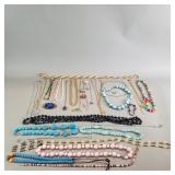 Group of costume jewelry - necklaces, earrings,