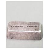 Silver bar marked 999+fine 5 troy oz.