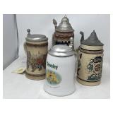Group of four German beer steins