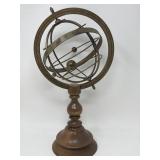 Vintage metal armillary sculpture on a wood base