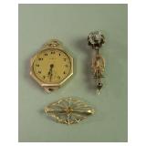 Pair of 10k gold brooches scratch tested, Elgin