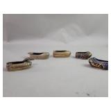 Five brass and enamel miniature shoe ashtrays