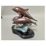 Sun Pacific International bronze dolphin sculpture