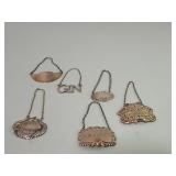 Six sterling silver bottle tags