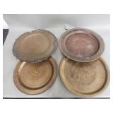 Four vintage engraved brass trays