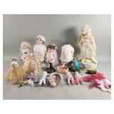 Group of vintage porcelain dolls and figural pin