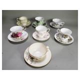Group of 7 porcelain teacups and saucers
