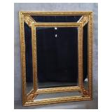 Carved wood gilt wall mirror