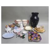 Group of porcelain and ceramic mugs, plates,