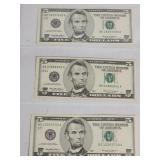 Three 1999 US $5 bills