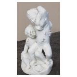 Cement cherub garden statue
