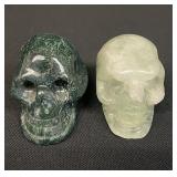 Pair of natural hand-carved stone skull figurines