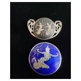 Pair of sterling silver and enamel brooches