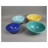 Four pottery mixing bowls