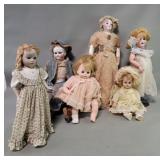 Group of vintage porcelain and fabric dolls
