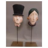 Pair of vintage carved wood masks on brass stands