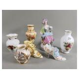 Group of porcelain vases, French figure, and