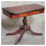 Brandt mahogany flip-top game table on casters