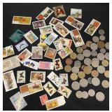 Group of vintage world coins and postage stamps