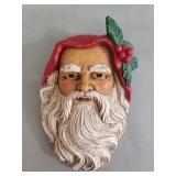 Three composite Santa Claus wall masks