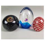 Three studio art glass papper weight two are