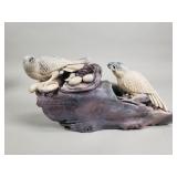 Carved stone bird sculpture