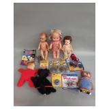 Box of vintage dolls and toys