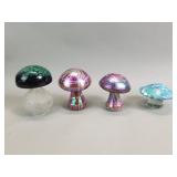 Four hand-blown art glass mushroom paperweights