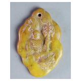 Carved jade pendant depicting a Buddhist monk