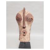 Vintage African carved wood mask on iron stand