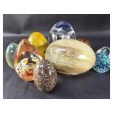 Group of glass and stone egg decorations