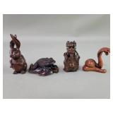 Four Japanese carved wood netsukes