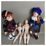 Group of vintage dolls with porcelain heads and