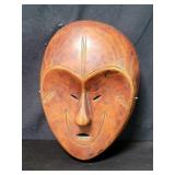 African carved wood Lega initiation mask