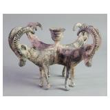 Vintage cast brass candleholder depicting a