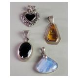 Four sterling silver and onyx. Amber, moonstone