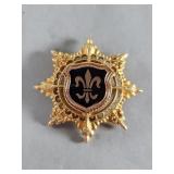 Gold tone and enamel fleur-de-lis 8 point star