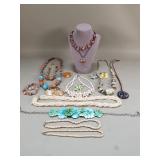 Group of colorful costume jewelry, shell, seed