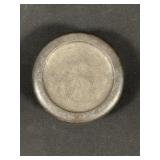 Signed tin and plastic trinket holder with design