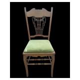 Antique wood chair with lime green cushion cover
