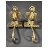 Pair of brass angel stocking hangers