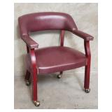 Contemporary faux leather arm chair on casters