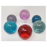 Group of Ikea glass sphere paperweights