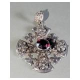 Silver Victorian style cross pendant with a red
