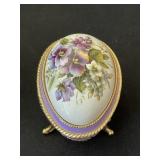 Vintage footed porcelain egg, music trinket box