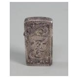 Silver lighter case with a  Zippo lighter i