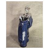 Vintage Wilson golf bag with clubs and rain cover